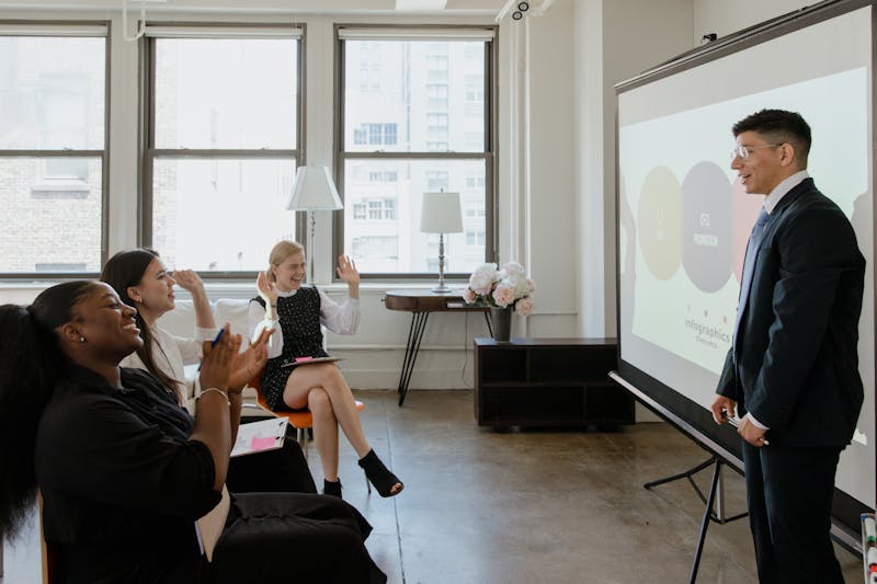 Our providers and staff during a team huddle — collaboration that ensures coordinated patient care